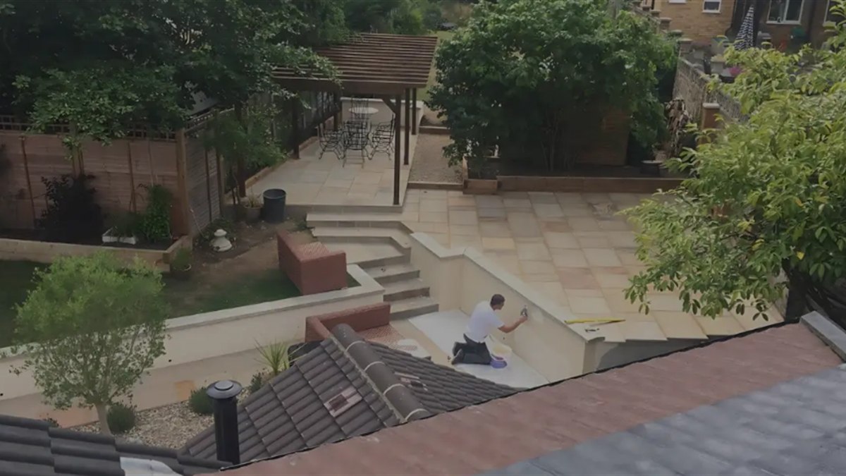 The rear terrace, steps and retaining walls completed as part of the same programme of works