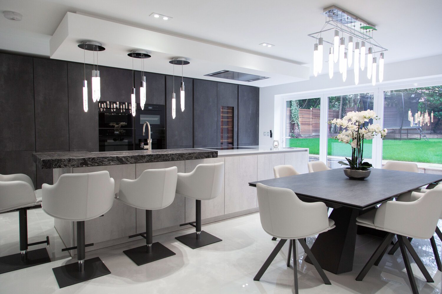 Period Home Luxury Renovation, Watford 3 The Leicht kitchen at the centre of the renovation, with a honed granite island and full-height glazing to the garden